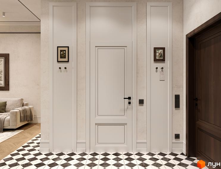 Інтер'єр апарт-готелю Apex з білими дверима, темними дверима та чорно-білою плиткою на підлозі. Декоративні елементи та картини додають затишку.
