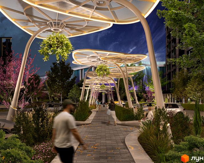 Житловий комплекс RIVERVILLE: сучасна архітектура з підсвіченими навісами та озеленена територія з пішохідною алеєю. Прибудинкова територія з місцями для відпочинку та автомобілями.