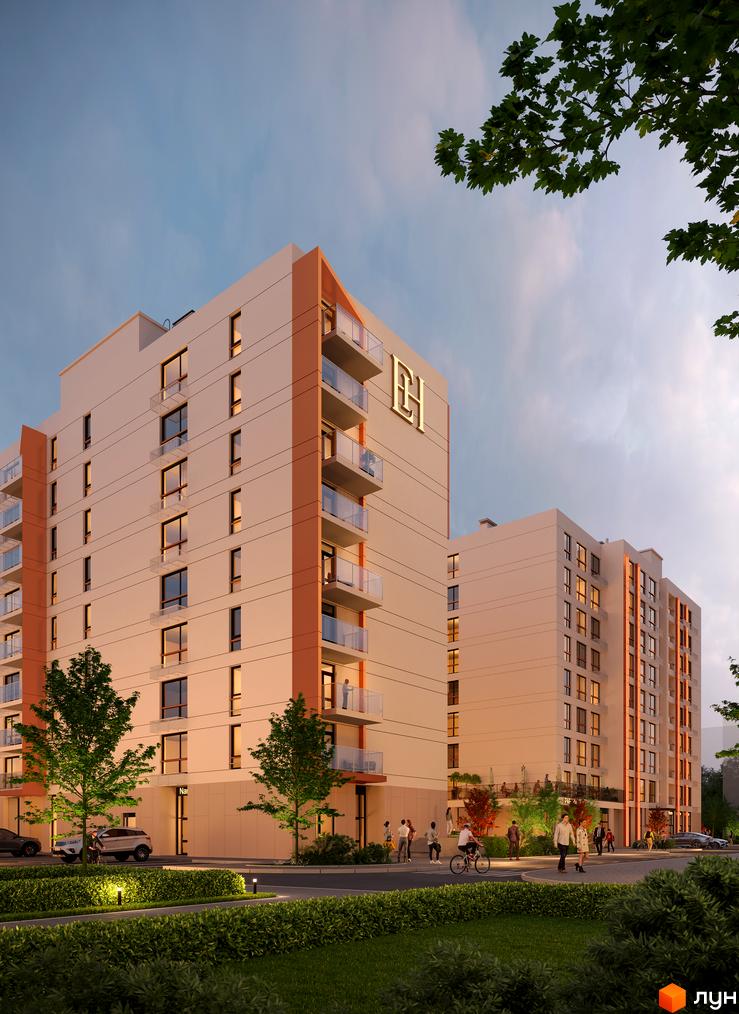 Новобудова Estet Hill з оранжевими елементами та скляними балконами, поруч зелена зона та люди на вулиці.