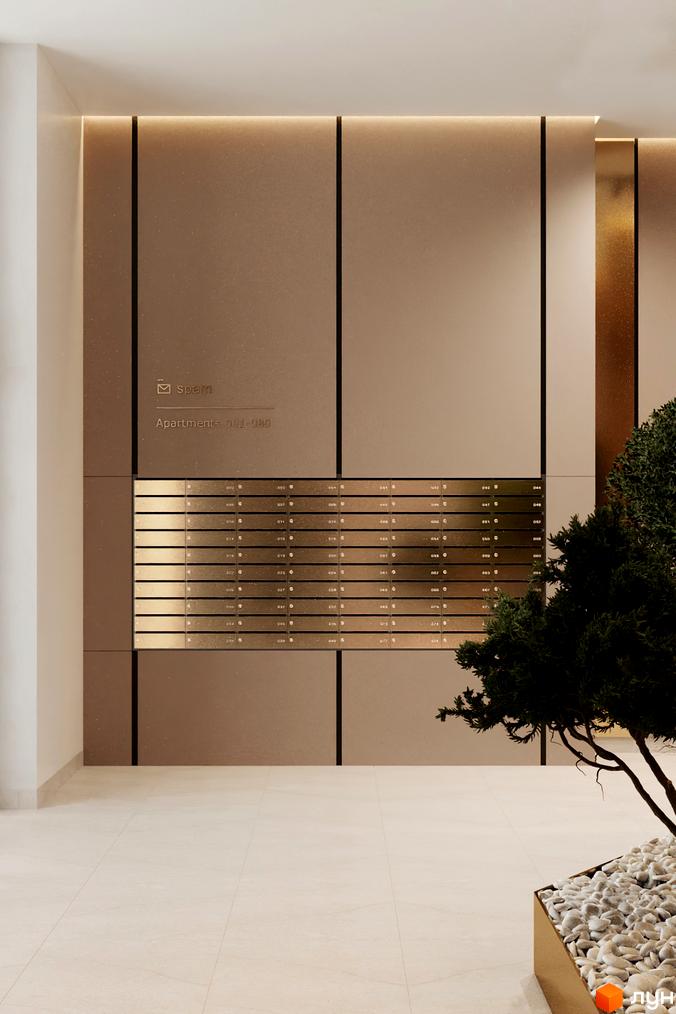 Вхідна група житлового комплексу Estet Hill з поштовими скриньками та елементами декору. Навколо розміщена зелена рослина та оздоблення стін.