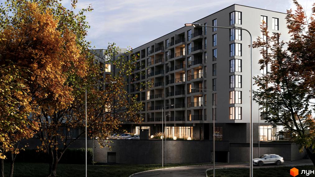 Житловий комплекс HILL SIDE з балконами та великими вікнами, оточений деревами восени. На передньому плані дорога та парковка.