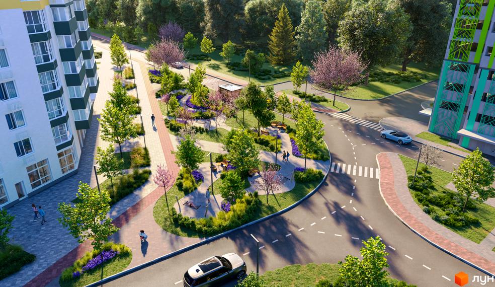 Житловий комплекс Сирецькі сади. Зелена прибудинкова територія з пішохідними доріжками, лавками та деревами.