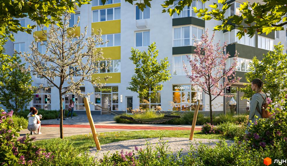 Житловий комплекс Сирецькі сади: фасади будівель з жовтими елементами та зелені дерева на прибудинковій території. Дитячий майданчик з гамаком.