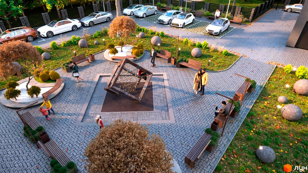 Зображення прибудинкової території Житлового комплексу Family Park з дитячим майданчиком та місцями для відпочинку.