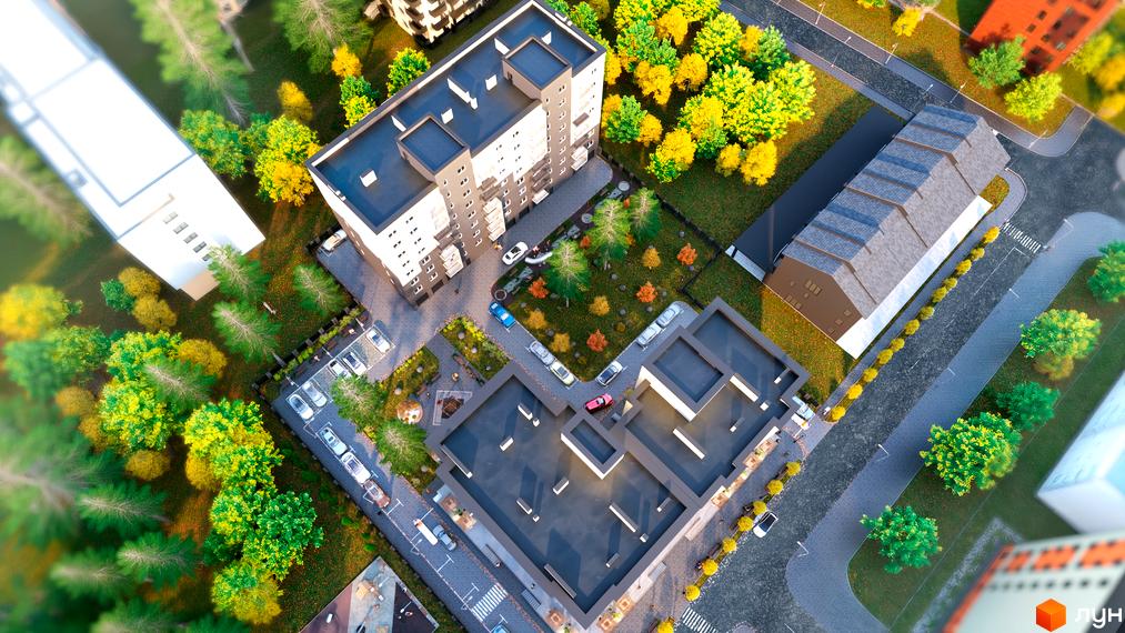 Вигляд зверху на Житловий комплекс Family Park з сірими багатоповерхівками та зеленими насадженнями. Навколо будинку парковка та дитячий майданчик.