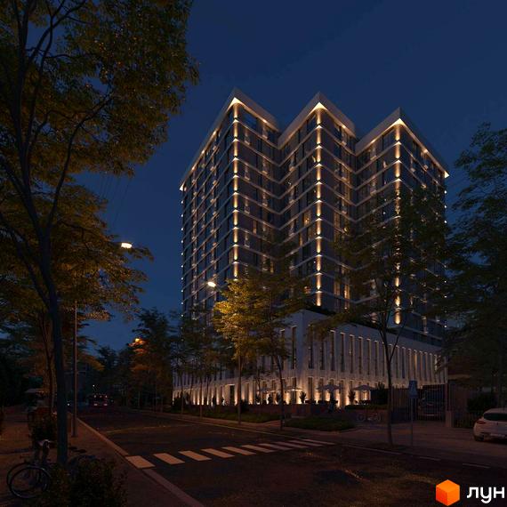 Зображення фасаду та прибудинкової території Новобудови TRIVIUM в нічний час. Вигляд з вулиці на освітлену будівлю.