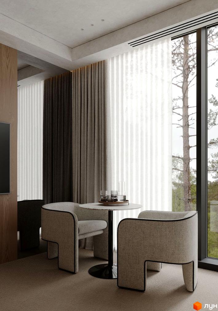 Інтер'єр з круглим столом та двома кріслами біля вікна в Будівельному проєкті Crystal Hills. Вид на зелену зону за вікном.