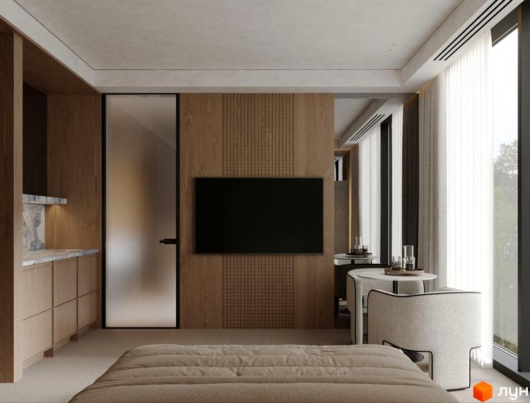 Інтер'єр апарт-комплексу Crystal Hills з телевізором, столом та ліжком. Вигляд кімнати з меблями у світлих тонах.