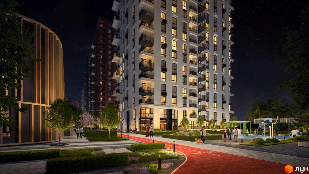Зображення Житлового комплексу Central Park Vinnytsia вночі. Високий будинок з балконами та червоною доріжкою для прогулянок.