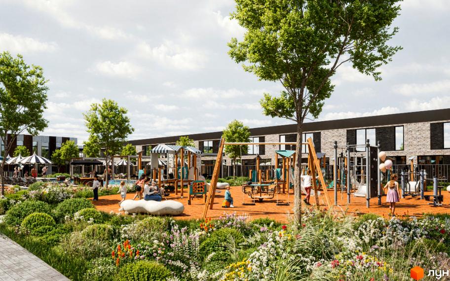 Зображення сторінки Житлового району Hollywood з таунхаусами та дитячим майданчиком. На передньому плані квіткові клумби.