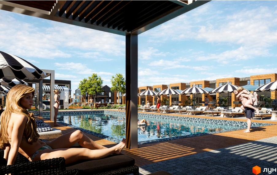 Вид на басейн та таунхауси Hollywood. Навколо басейну розташовані лежаки та парасольки, що створюють затишну атмосферу.