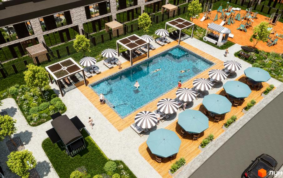Зображення Житлового комплексу Hollywood з басейном, парасольками та зонами для відпочинку. Вид зверху на прибудинкову територію.