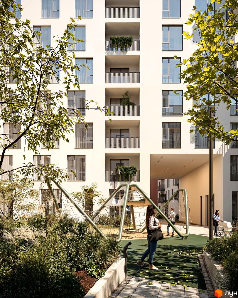 Зовнішній вигляд будинку в Житловому комплексі Novatsia. На передньому плані зелена територія з дитячим майданчиком.