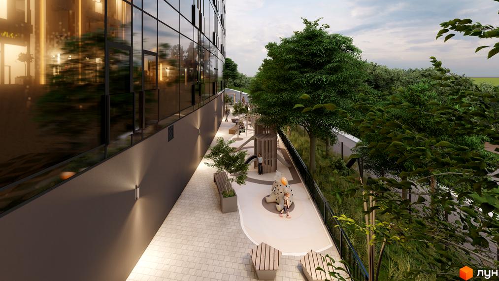 Emily Apartments: фасад будівлі з панорамним склінням та дитячий майданчик з елементами гри в оточенні зелені.