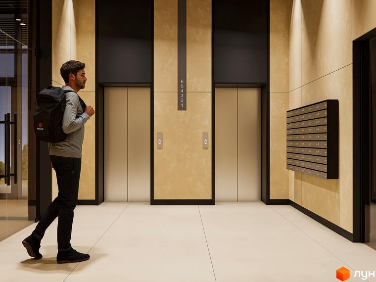 Житловий комплекс Emily Apartments: сучасний вхід з ліфтами та поштовими скриньками. Чоловік з рюкзаком йде до ліфта.