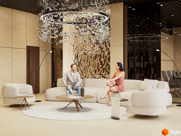 Інтер'єр вітальні в ЖК Emily Apartments з диваном, кріслами та журнальними столиками. Сучасний дизайн та оздоблення створюють затишну атмосферу.