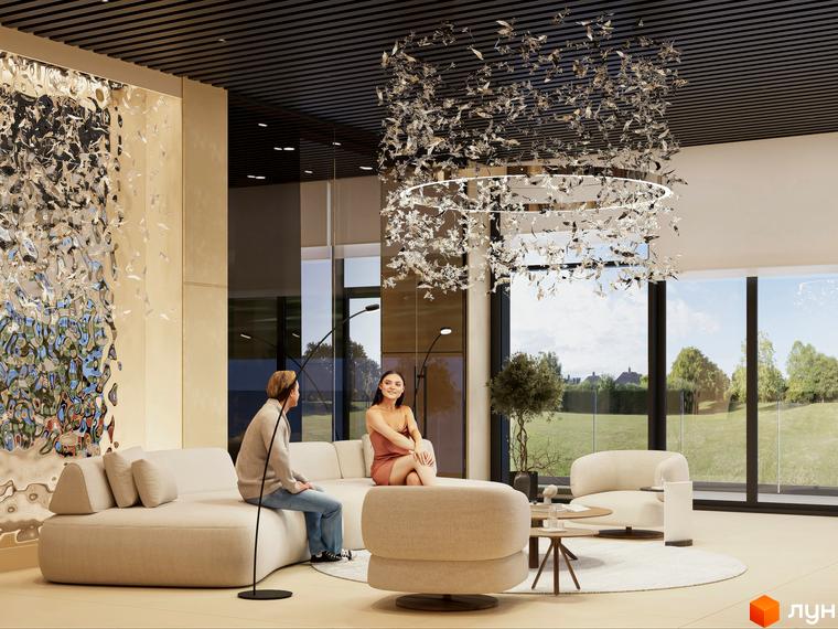 Інтер'єр вітальні в ЖК Emily Apartments з диваном, кріслом та великими вікнами, що виходять на зелену галявину.