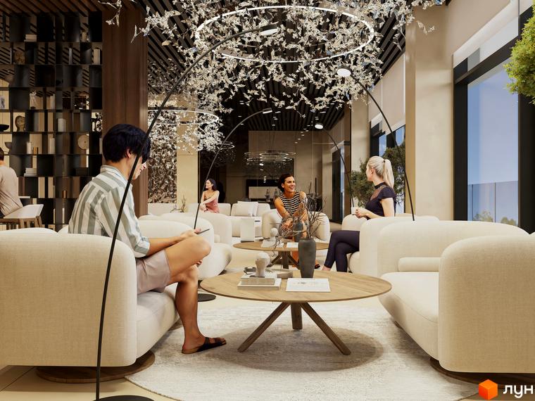 Інтер'єр лобі житлового комплексу Emily Apartments з диванами, журнальним столиком та декоративним освітленням. Люди відпочивають у зоні очікування.