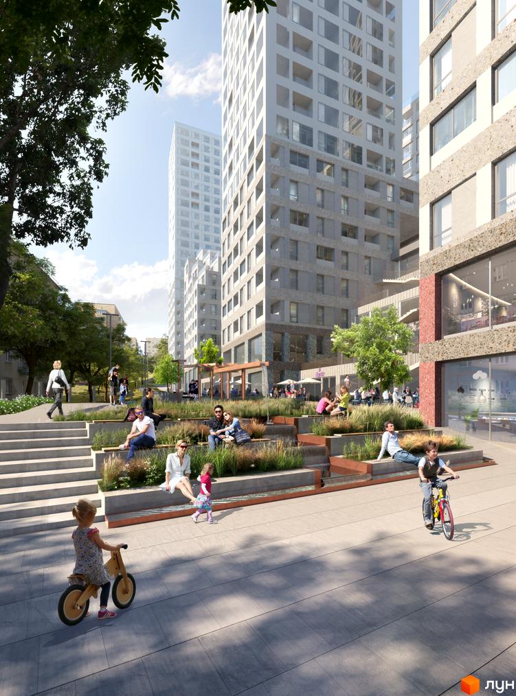 Житловий комплекс OZON Concept House з багатоповерховими будинками та зеленою прибудинковою територією, де відпочивають люди.