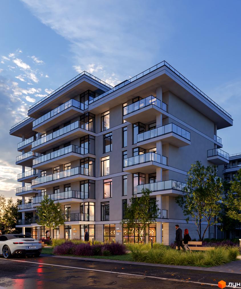 Житловий комплекс Медовий: багатоповерхова новобудова з балконами та панорамними вікнами, освітлена ввечері, з доглянутою прибудинковою територією та деревами.