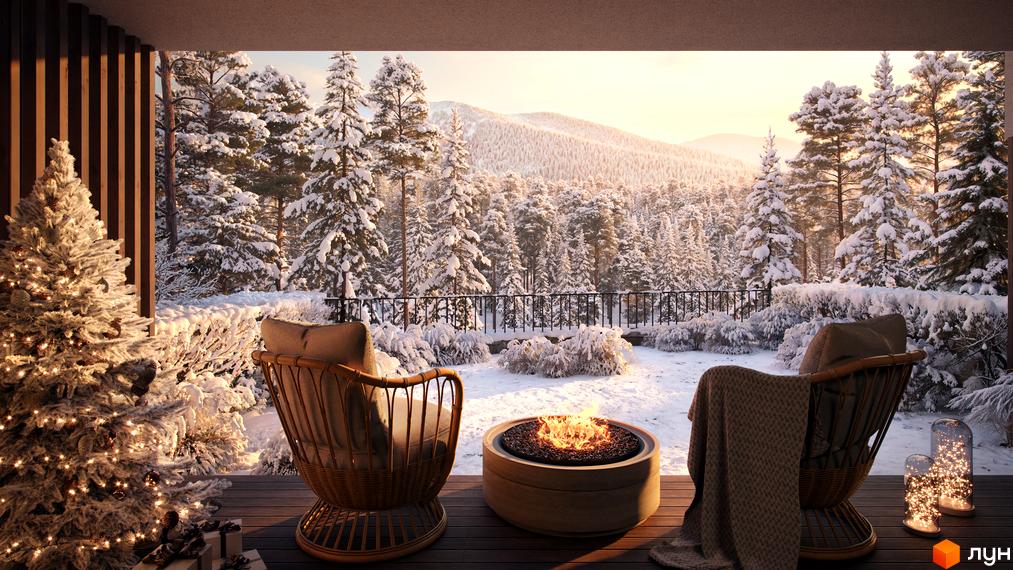 Котеджне містечко Mountain Residence premium villas&spa з ялинкою та каміном на терасі на фоні засніженого лісу та гір. Затишна атмосфера зимового відпочинку.