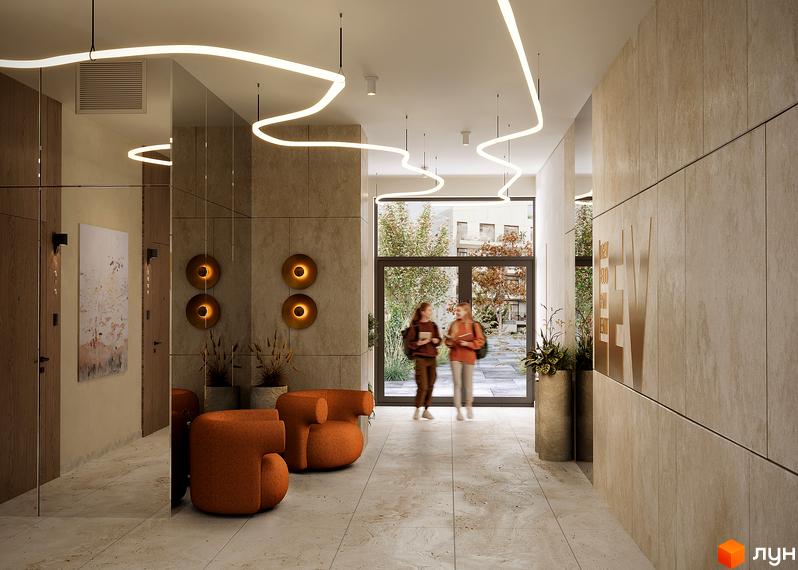 Лобі новобудови ЖК SOUL PARK з двома помаранчевими кріслами та великими дверима, що ведуть назовні.