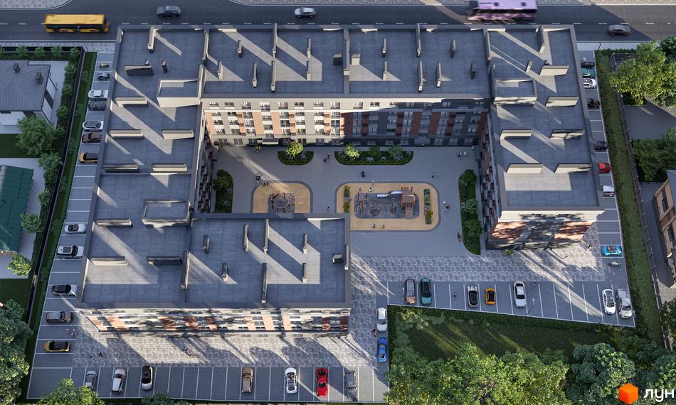 Житловий комплекс Kvartal Soborna - вид зверху на будівлі з сірими дахами та цегляними фасадами, внутрішнім двориком з дитячими майданчиками та парковкою.