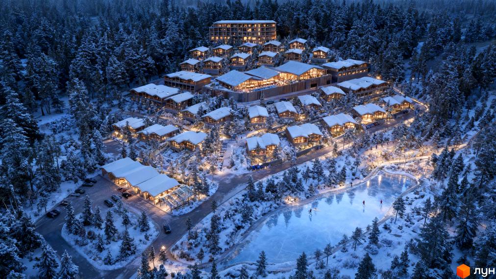 Котеджне містечко Chamonix Premier Resort взимку, з дерев'яними будинками під снігом та льодовою ковзанкою.