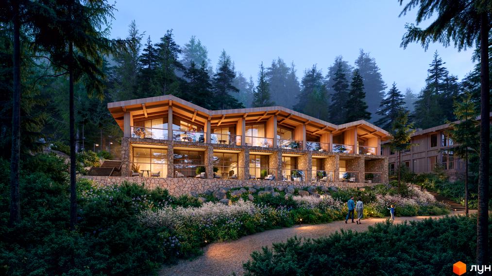 Котеджне містечко Chamonix Premier Resort з кам'яним фасадом та дерев'яними елементами, оточене лісом та квітучими рослинами.