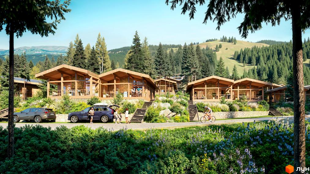 Котеджне містечко Chamonix Premier Resort з дерев'яними будинками та кам'яним оздобленням на тлі гірського пейзажу. На території - доглянутий ландшафт з квітами та деревами.