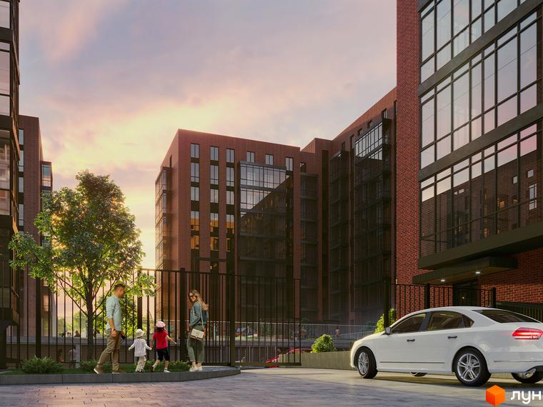 Новобудова ЖК Стандарт з червоної цегли з великими вікнами та прибудинковою територією з деревами та дитячим майданчиком.