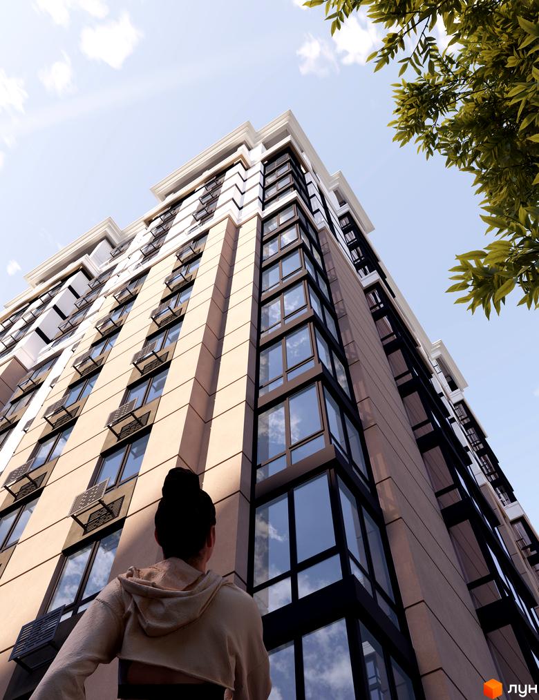 Новобудова Bucha Prestige з панорамними вікнами та кондиціонерами на фасаді, вид знизу на тлі блакитного неба та зелені дерев.