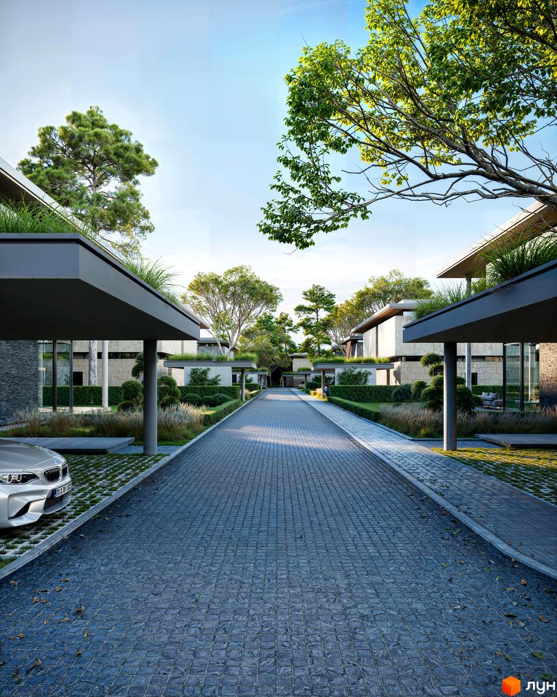 Котеджне містечко KM UNIQUE: сучасні будинки з зеленими дахами та доглянутою прибудинковою територією, вимощеною бруківкою.