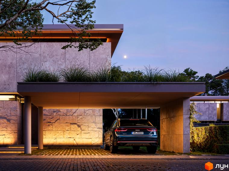 Котеджне містечко KM UNIQUE: сучасна архітектура будинку з кам'яним фасадом та прибудинковою територією з освітленням. Автомобіль припаркований під навісом.