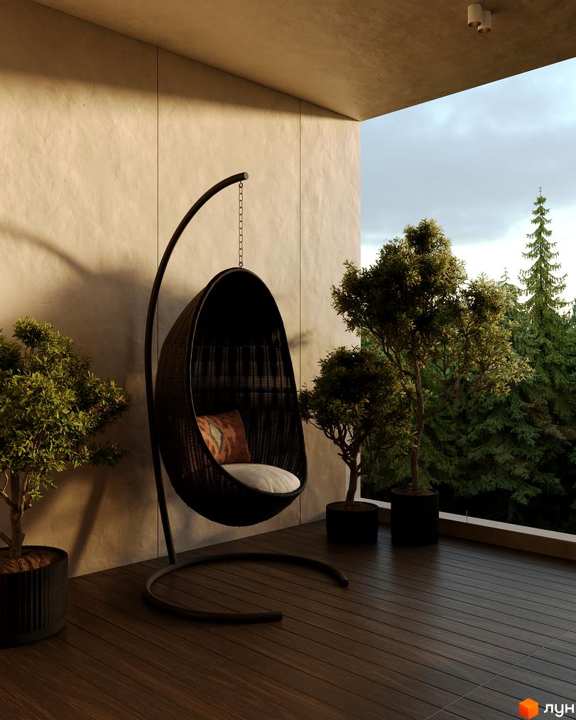 Апарт-комплекс PHOENIX MEDICAL RESORT з зоною відпочинку на балконі та зеленими деревами на тлі лісу. Сучасний дизайн новобудови.