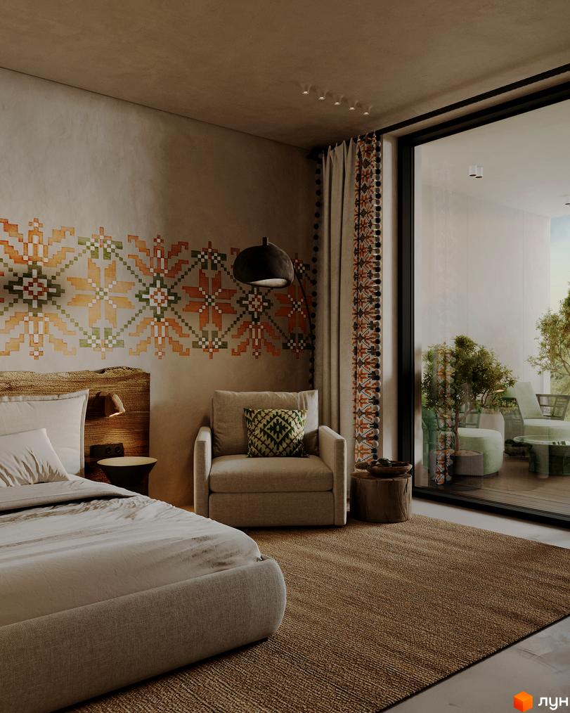 Інтер'єр спальні апарт-комплексу PHOENIX MEDICAL RESORT з етнічним орнаментом на стіні та виходом на терасу.