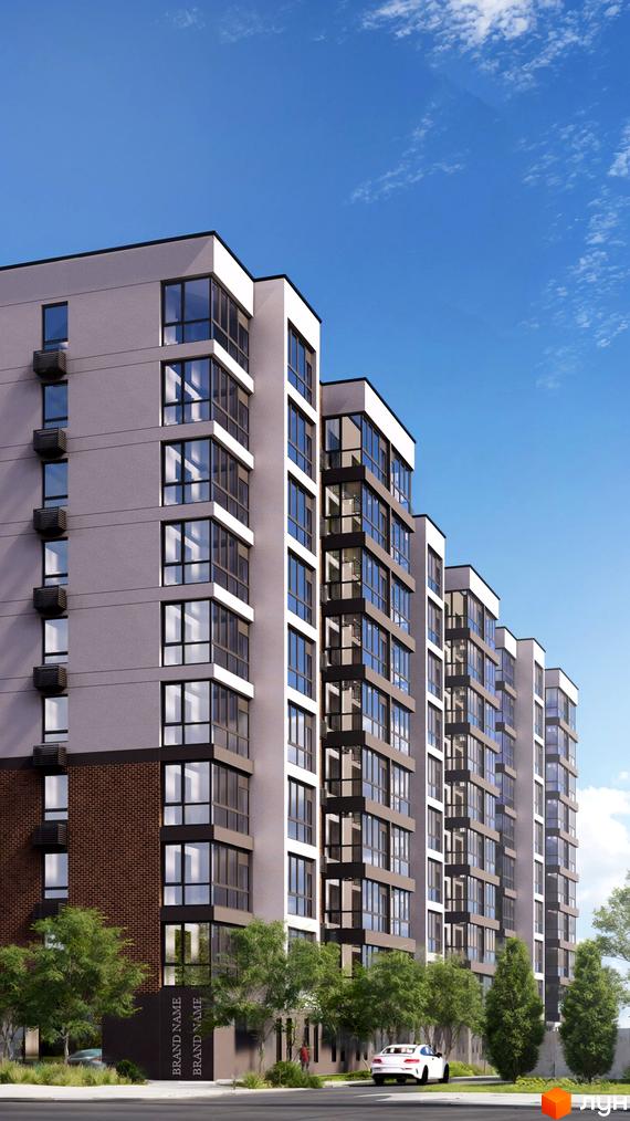 Новобудова Альянс з великою кількістю вікон та балконів, оточена деревами та з автомобілями на фоні.