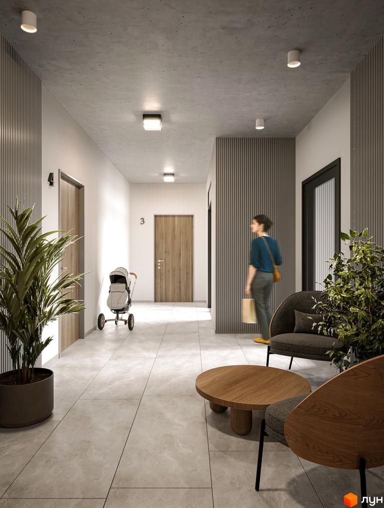 Сучасний дизайн холу новобудови ЖК на Лисеницькій з дверима, коляскою та зоною відпочинку. Опис інтер'єру житлового комплексу.