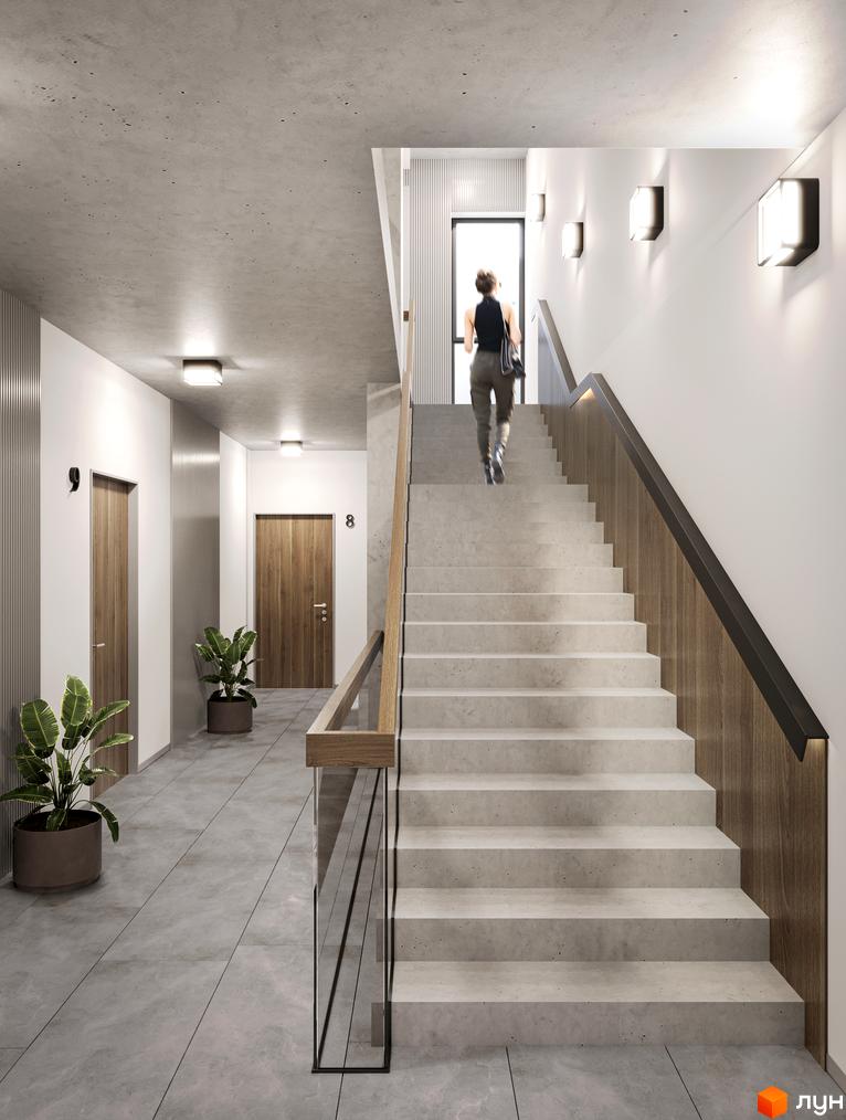 Інтер'єр сходової клітини в новобудові ЖК на Лисеницькій з дерев'яними дверима та сходами з бетону.