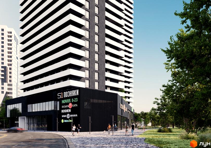 Новобудова S1 Позняки з чорно-білим фасадом та комерційними приміщеннями на першому поверсі. Поруч зелена зона з деревами та пішохідною доріжкою.