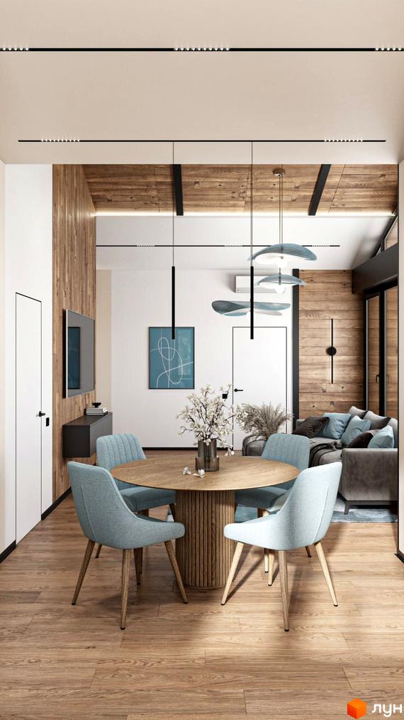 Інтер'єр вітальні в будинку КМ Bucha Village. Світла обробка стін, дерев'яна підлога, круглий стіл та м'які стільці.