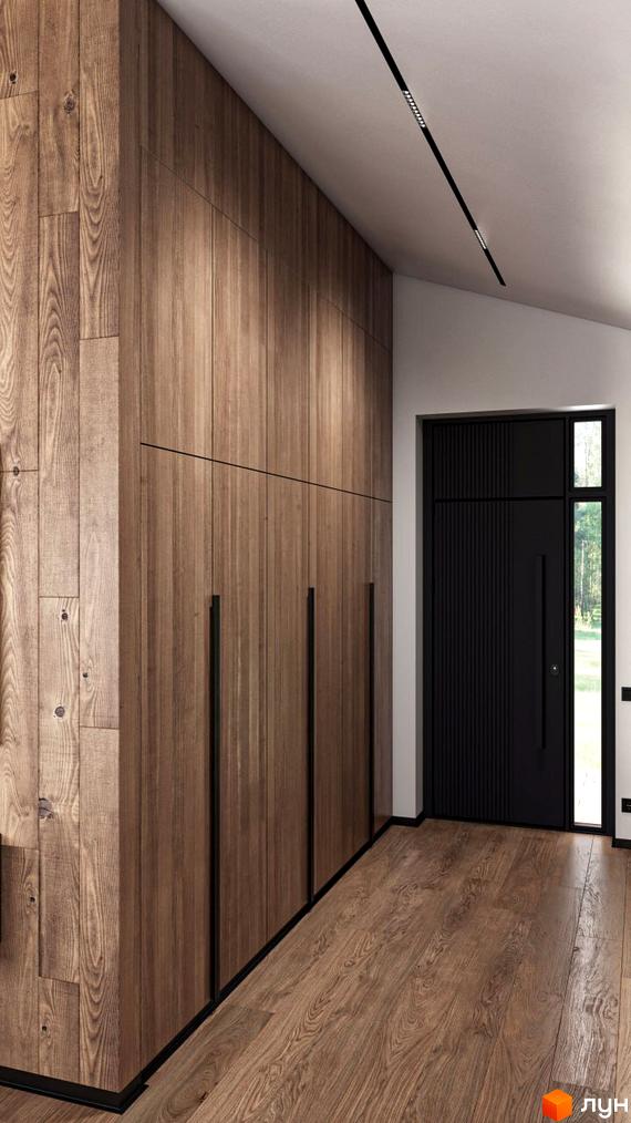 Дерев'яна обшивка стін в коридорі будинку. Чорні двері та ручки. Коричнева підлога з дерев'яним покриттям.