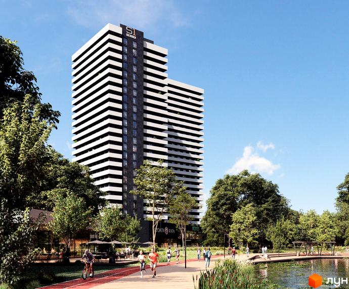 Висотна будівля ЖК S1 Позняки з білими та чорними смугами на фасаді. На передньому плані доглянута прибудинкова територія з алеями, озером та зеленню.