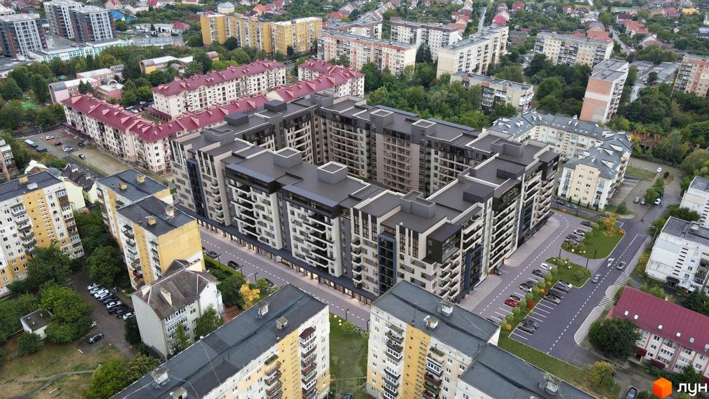 Вид на багатоповерховий будинок ЖК GARDEN CITY з великою прибудинковою територією, паркуванням та зеленими насадженнями.