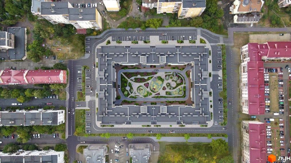 Житловий комплекс GARDEN CITY: аерофотографія багатоквартирного будинку сірого кольору з внутрішнім двором, зеленими насадженнями та дитячими майданчиками, оточеного парковками та дорогами.