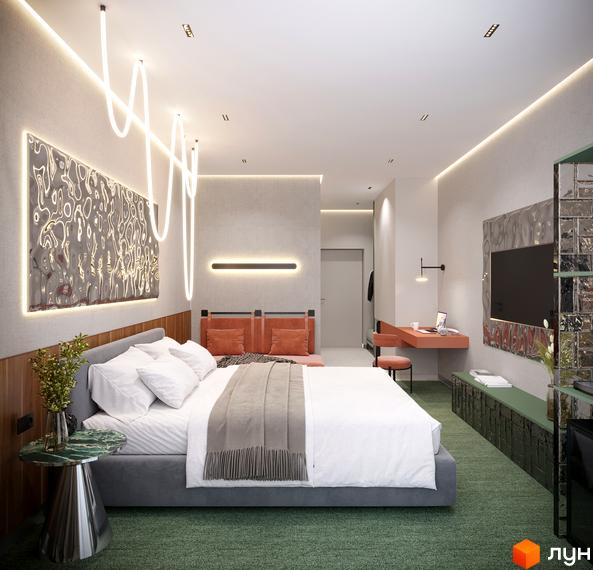 Інтер'єр спальні в апарт-комплексі KARDAMON RESORT & SPA з ліжком, робочим столом та художнім освітленням.