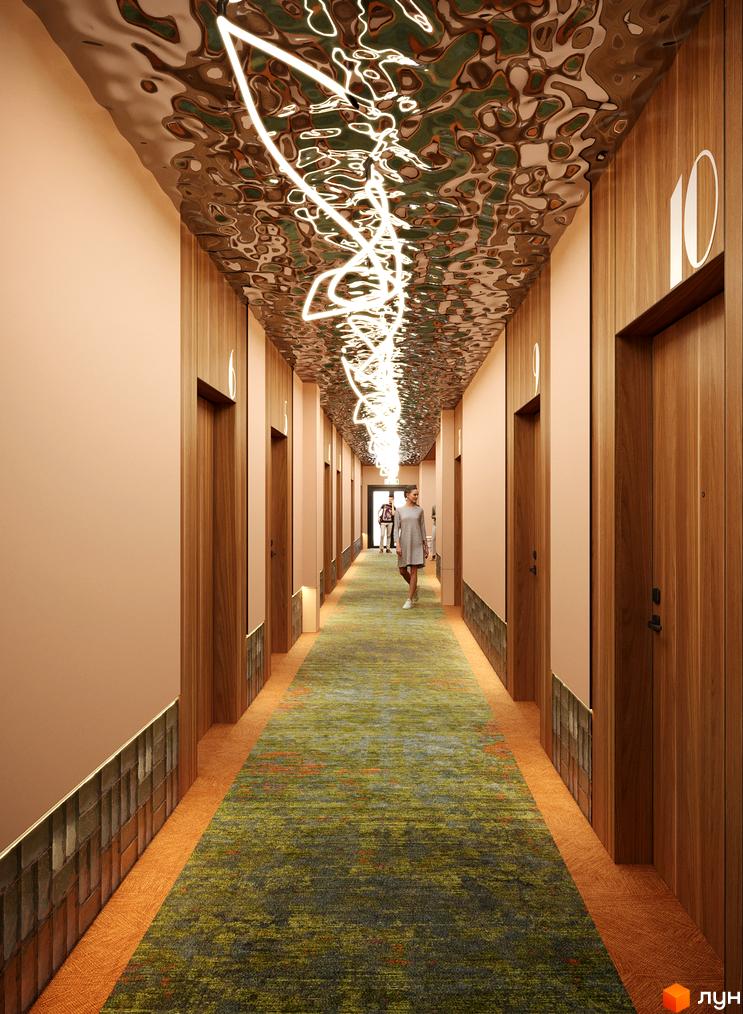 Інтер'єр коридору Комплексу KARDAMON RESORT & SPA. Видно дерев'яні двері, світлі стіни, рельєфну стелю з підсвічуванням та килимове покриття.