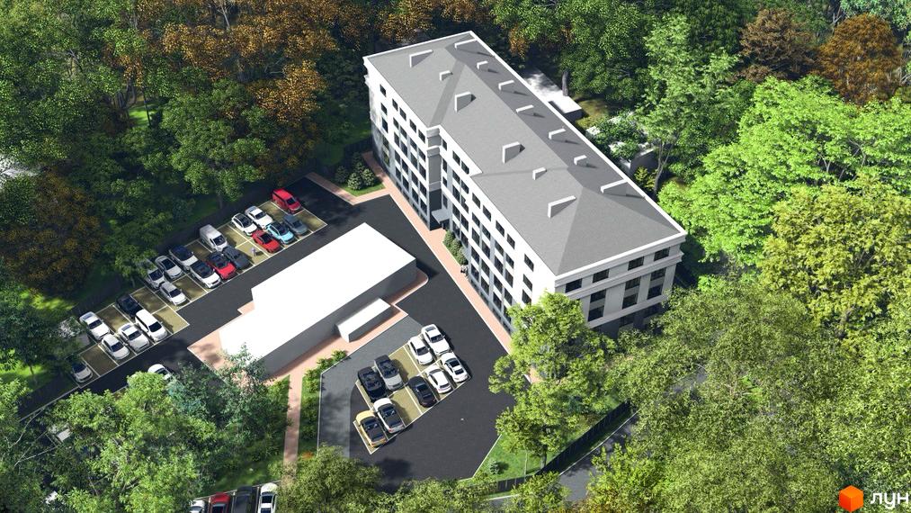 Житловий комплекс Comfort Hall: вид зверху на білий багатоповерховий будинок з сірим дахом, оточений зеленими деревами та парковками з автомобілями.