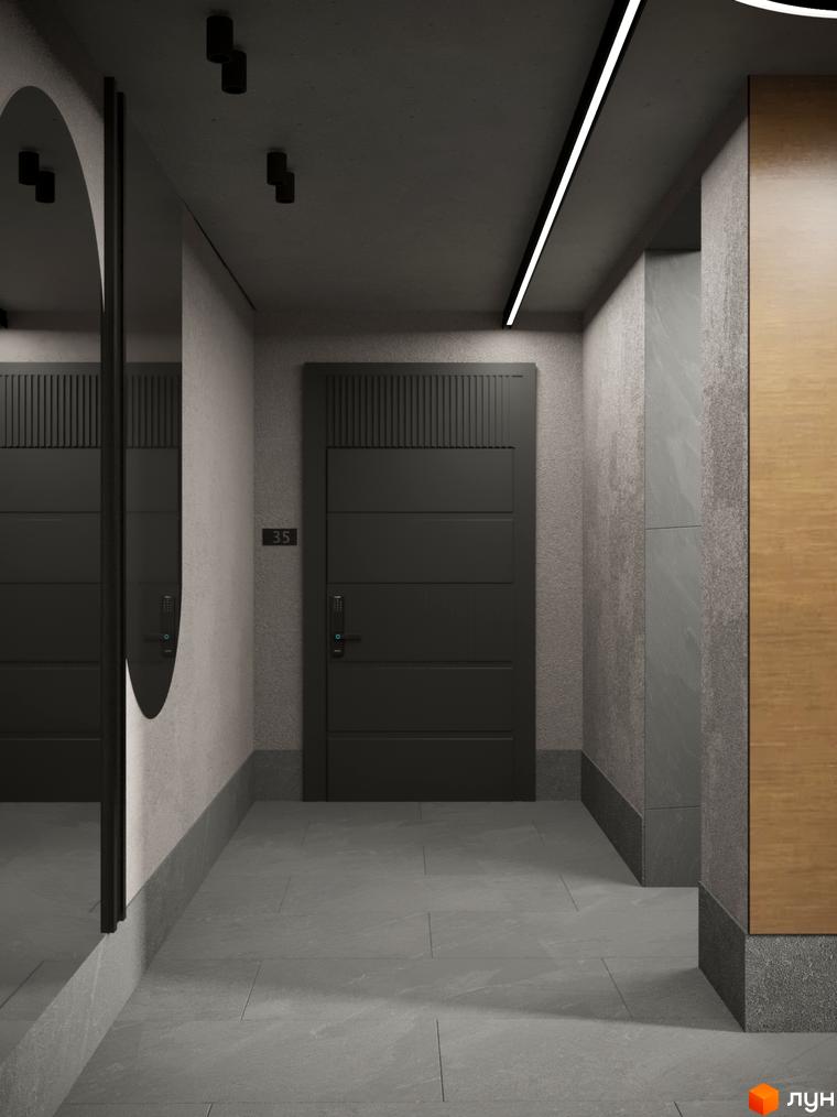 Вхідна група квартири в Житловому комплексі Eden Park з темними дверима, номером 35, дзеркалом та сірими стінами і підлогою.