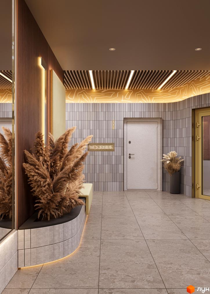 Житловий комплекс Woodside: інтер'єр вхідної групи з плитковими стінами, декоративними рослинами та освітленням. Просторий хол з білими дверима.